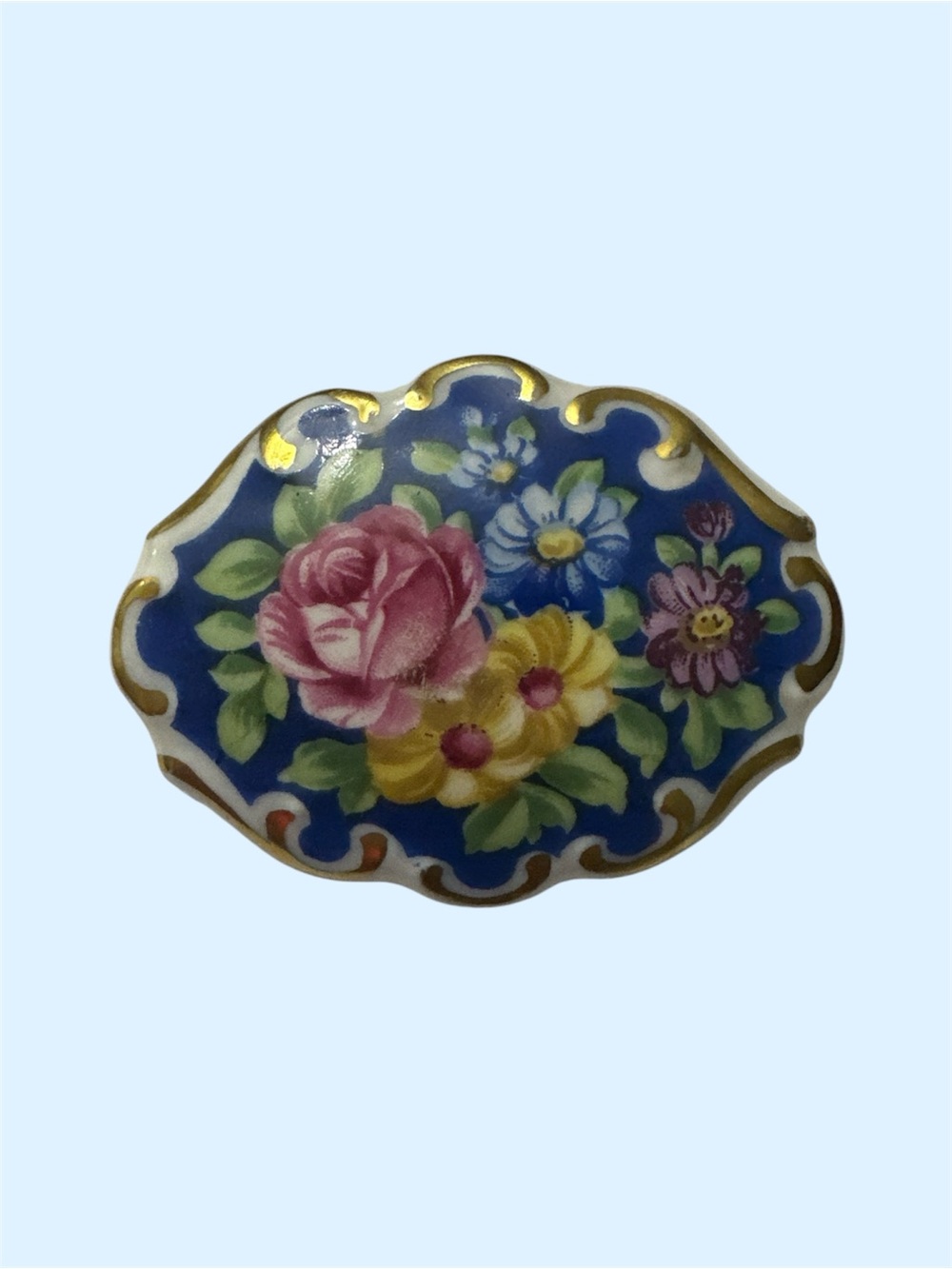 Floral ceramic Brooch with Gold  tone Accents - Blue Background
